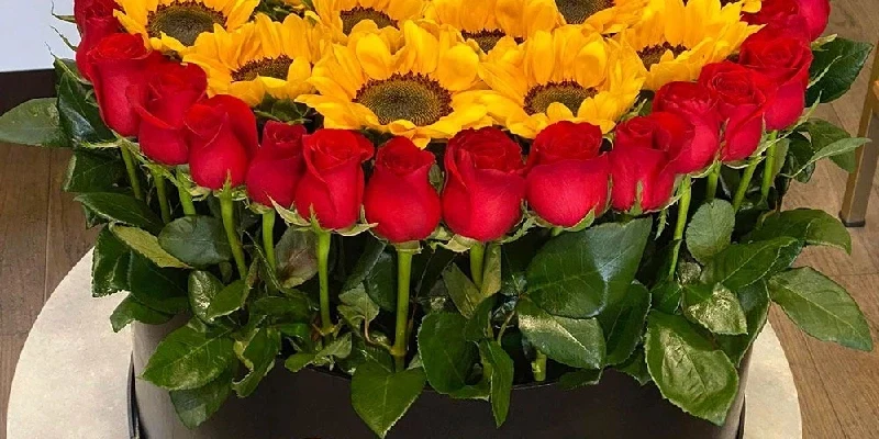 round black box with sunrise sunflowers and roses sunny dawn