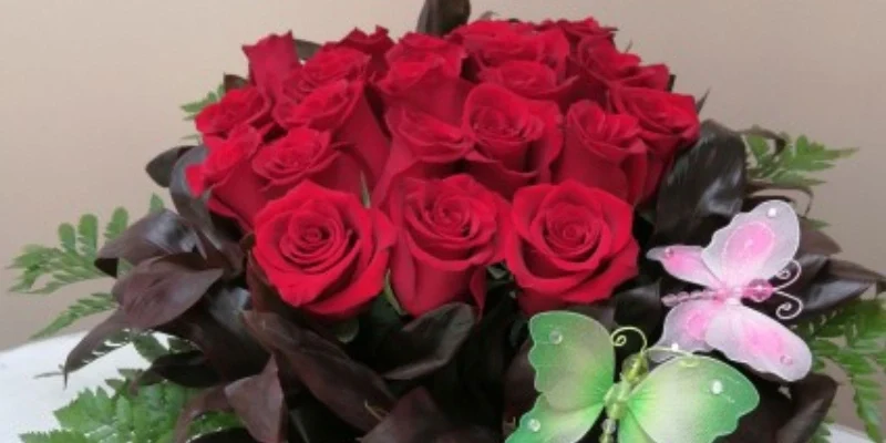 box of 24 red roses and butterflies